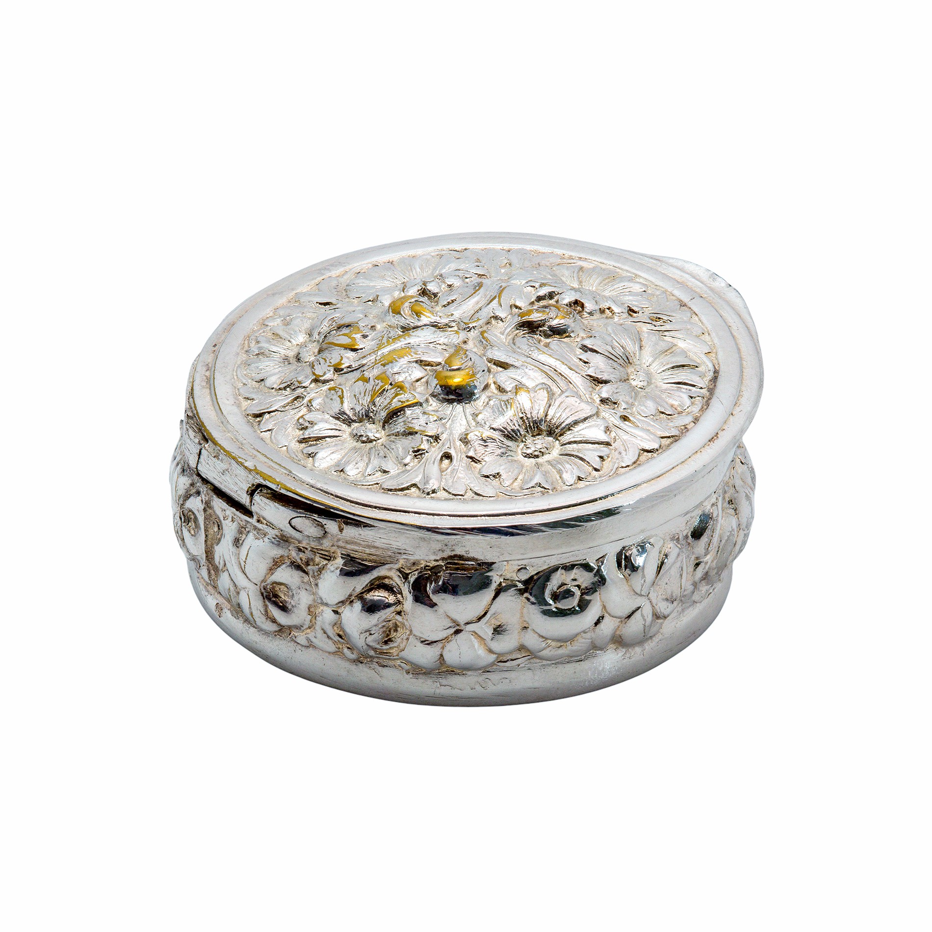 Versilberte Pillendose mit floraler Reliefverzierung